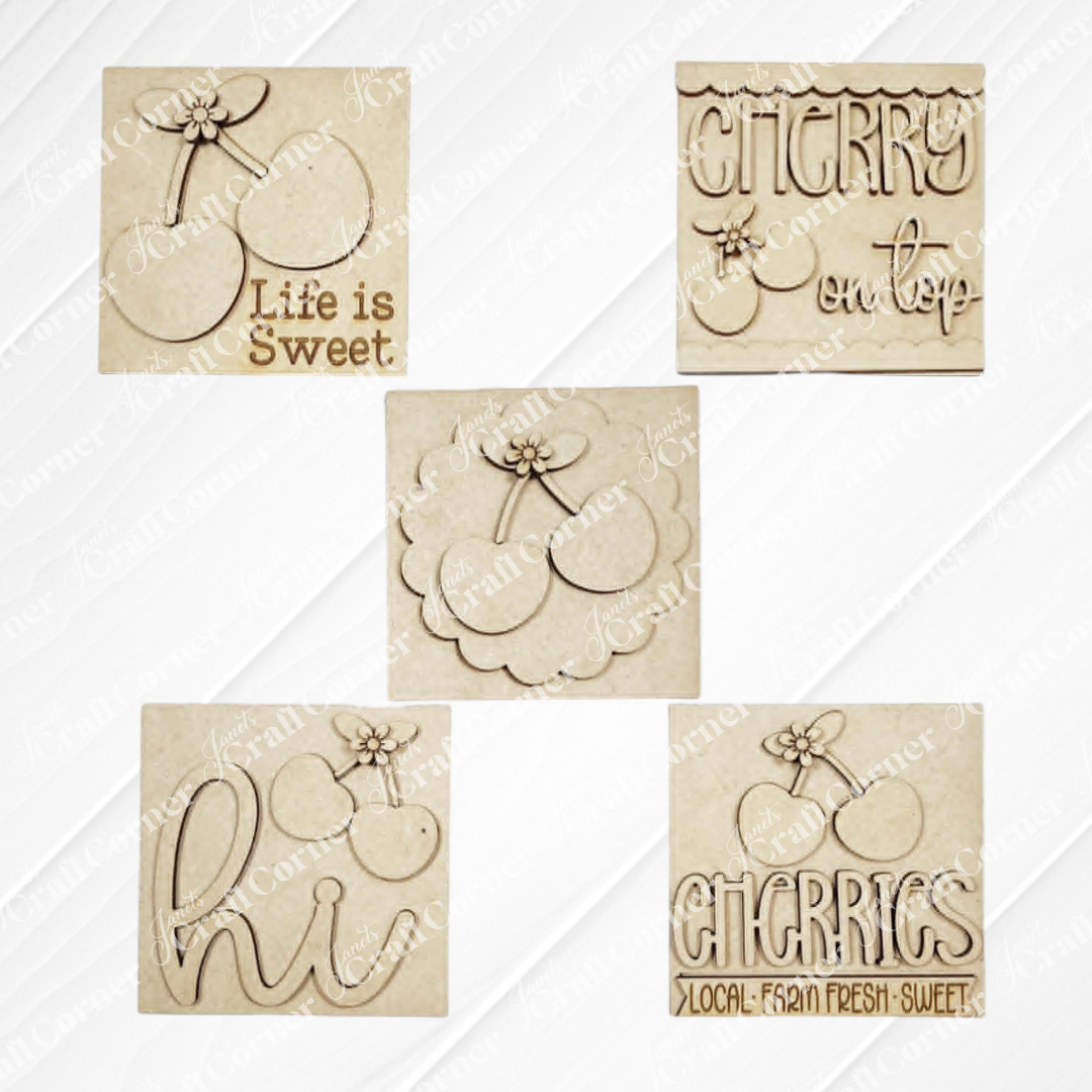Janet's Craft Corner Cherry Squares DIY kit includes 5 beige, cherry-themed Swappable Squares with designs like "Life is Sweet," "Cherry on top," "hi," a local-fresh-sweet motif, and a cherry illustration—perfect for tiered tray decor.