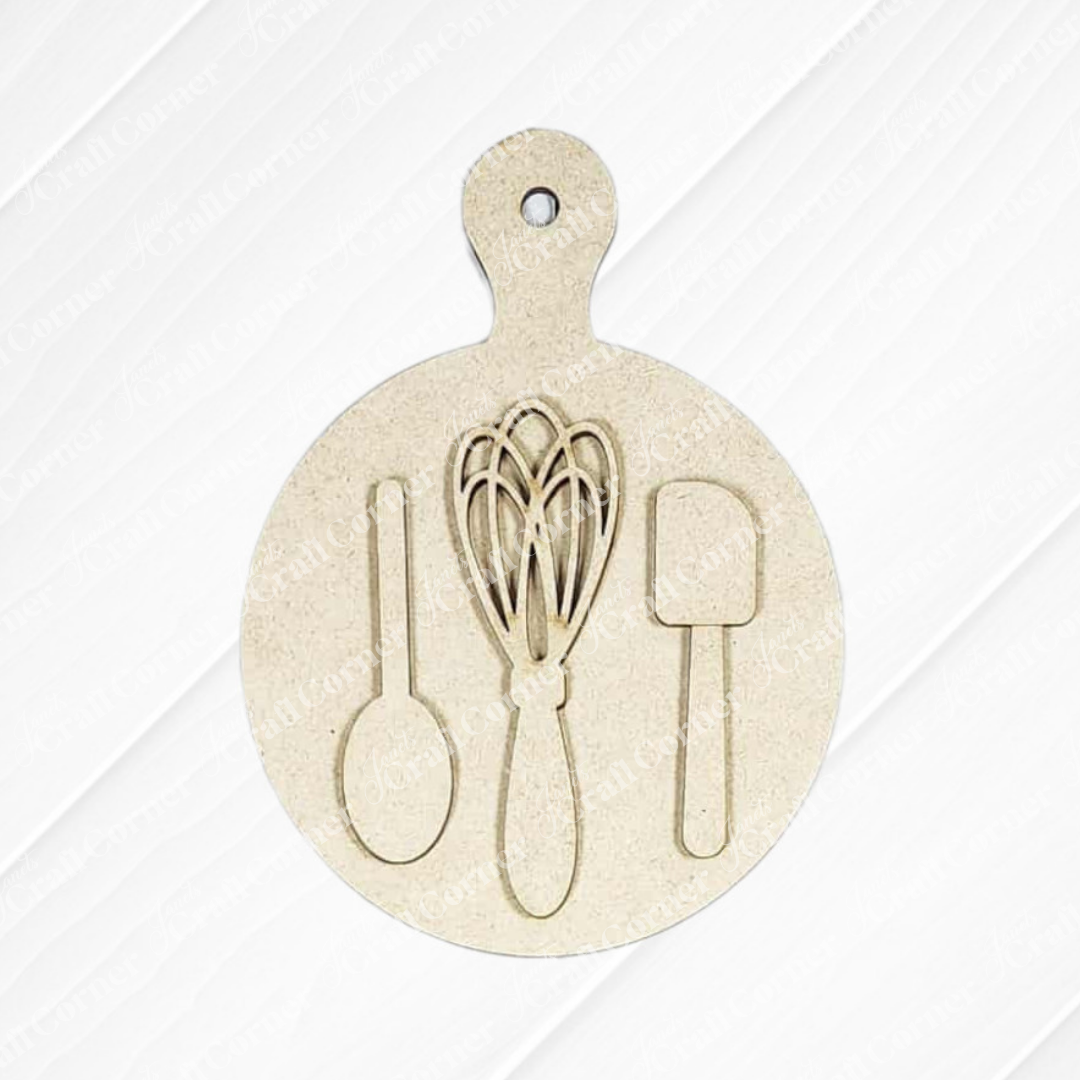 Display your Christmas Baking Mini Shelf Sitters DIY craft kit from Janet's Craft Corner on a festive round wooden cutting board featuring utensil outlines and a handy hanging hole—ideal for seasonal home décor.