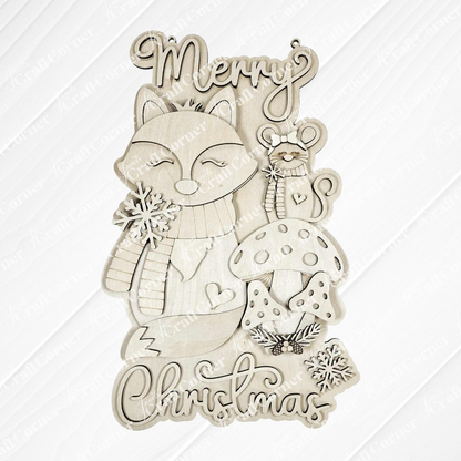 Janet's Craft Corner Christmas Fox Door/Wall Hanger DIY kit features a fox in a scarf, mouse with candy cane, mushrooms, snowflakes, and "Merry Christmas"—perfect for festive decorating or as a fun craft project. Set of 1.