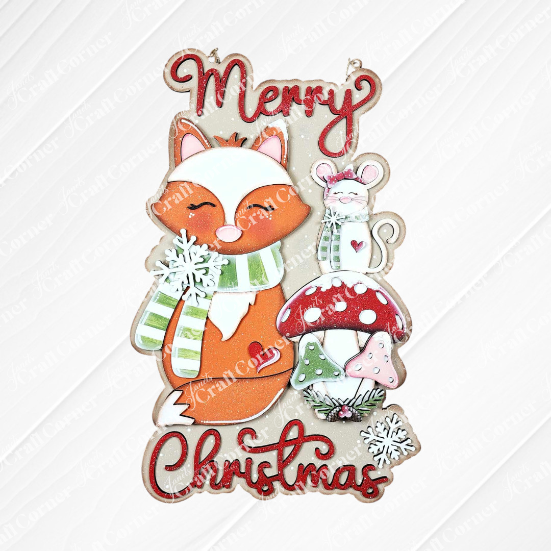 Janet's Craft Corner Christmas Fox Door/Wall Hanger DIY kit includes a smiling fox in a green striped scarf, white mouse, red mushrooms, and snowflakes. This set of 1 is perfect for festive home decorating!.