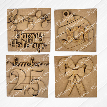 Janet’s Craft Corner Christmas Icon Swappable Squares DIY kit includes four wooden ornaments: “Happy Holidays” with lights, a “JOY” bauble, “December 25,” and crossed candy canes—perfect for your seasonal home decor or craft projects.