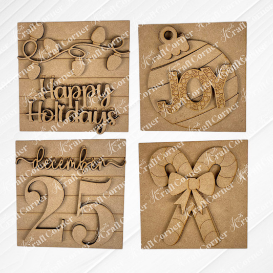 Janet’s Craft Corner Christmas Icon Swappable Squares DIY kit includes four wooden ornaments: “Happy Holidays” with lights, a “JOY” bauble, “December 25,” and crossed candy canes—perfect for your seasonal home decor or craft projects.