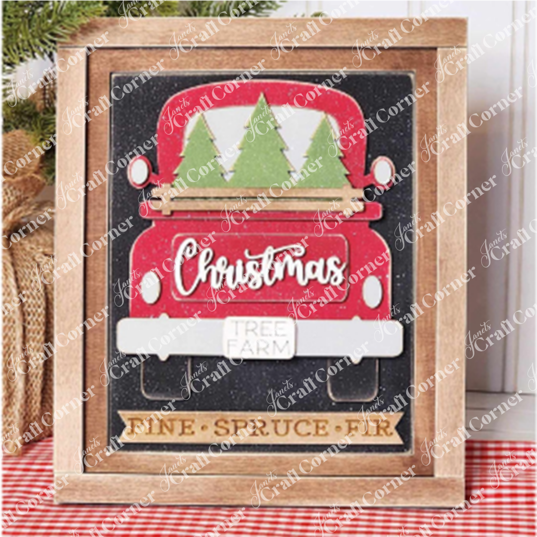 Add a festive crafted touch to your home with the Christmas Truck Switchable Farmhouse Sign by Janet's Craft Corner. This DIY craft kit features a hand-painted red Christmas truck carrying green trees. The truck is adorned with a "Christmas Tree Farm" sign, and below it, on a wooden plank, are the words "Pine," "Spruce," and "Fir," all set against a sparkling black background—perfect for your seasonal DIY home decor projects!