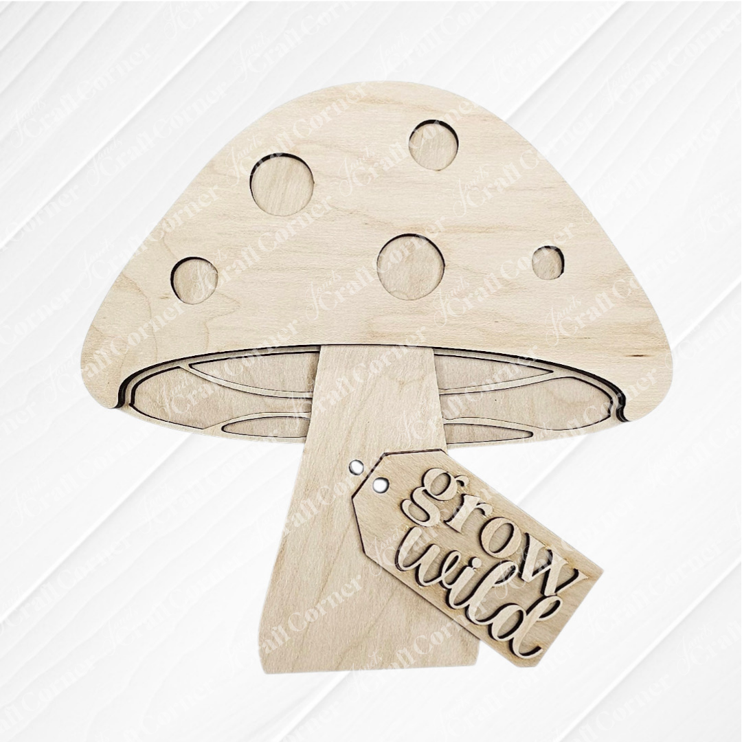 The Fall Chunky Mini Shelf Sitters DIY craft kit by Janet's Craft Corner features a wooden mushroom cutout with spots and a “grow wild” tag—perfect for autumn decor or as an adorable Fall shelf sitter. Choose from 3 designs!.