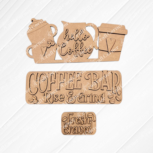 The Coffee Bar Interchangeable Insert from Janet's Craft Corner is a DIY home decor kit featuring hand-painted coffee-themed cutouts. It includes a teapot and cups with "hello Coffee," a "COFFEE BAR" sign with "Rise & Grind," and a small "Fresh Brewed" sign, all set against textured white tiles. Beautifully arranged on burlap fabric, these inserts are perfect for adding charm to your space.