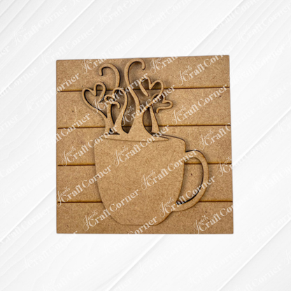 Janet's Craft Corner Coffee Swappable Squares is a DIY seasonal home decor craft kit featuring a wooden coffee mug cutout with heart steam, set on a square slatted background—ideal for coffee lovers and creative projects.