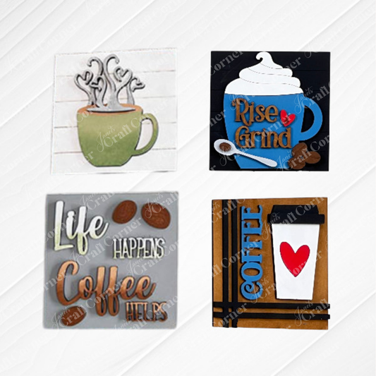 Set of four "Coffee Swappable Squares" by Janet's Craft Corner—square wooden plaques with coffee-themed designs like "Life Happens Coffee Helps." Ideal for DIY home decor or adding charm to small spaces. Painted in a green and brown or red, white and blue color scheme. Displayed on a white background.