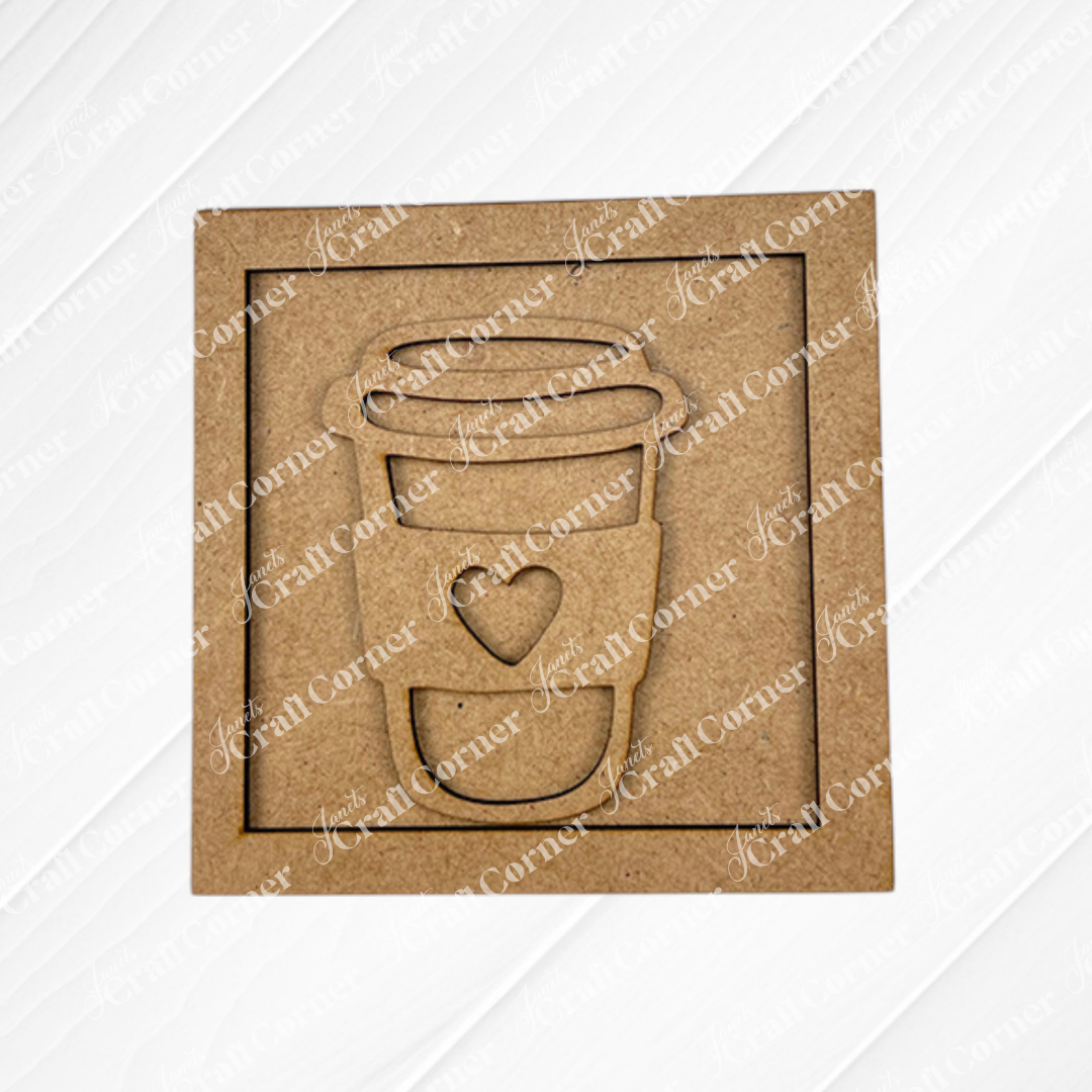 Coffee Bar Swappable Squares by Janet's Craft Corner: A brown square cardboard with a to-go coffee cup cutout featuring a heart on the sleeve—ideal for DIY home decor. Set against a white, textured, decorative background.