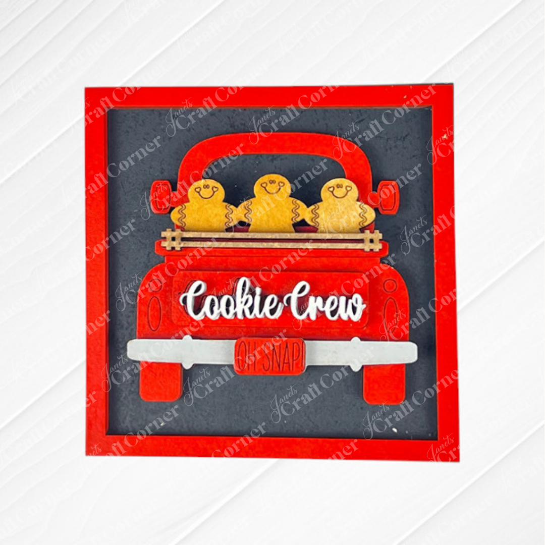Gingerbread Squares by Janet's Craft Corner—a DIY seasonal home decor wood craft kit featuring a charming design, set against a dark background with a red border.
