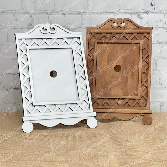 Janet's Craft Corner Cottage Frame for Switchable Farmhouse Signs is a DIY seasonal home decor kit, shown here in white and natural wood on burlap with a brick wall backdrop—perfect for displaying interchangeable farmhouse signs.