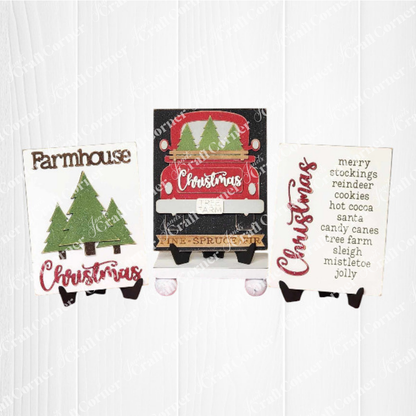 Janet's Craft Corner – Sample painted set of Country Christmas Switchable Farmhouse Signs are DIY seasonal home decor kits with a country Christmas theme. One features the wood cut-out word “Christmas” with words that evoke the holiday season, another features a set of three Christmas trees and the last features an antique truck with the word Christmas on its tailgate and trees in its bed.