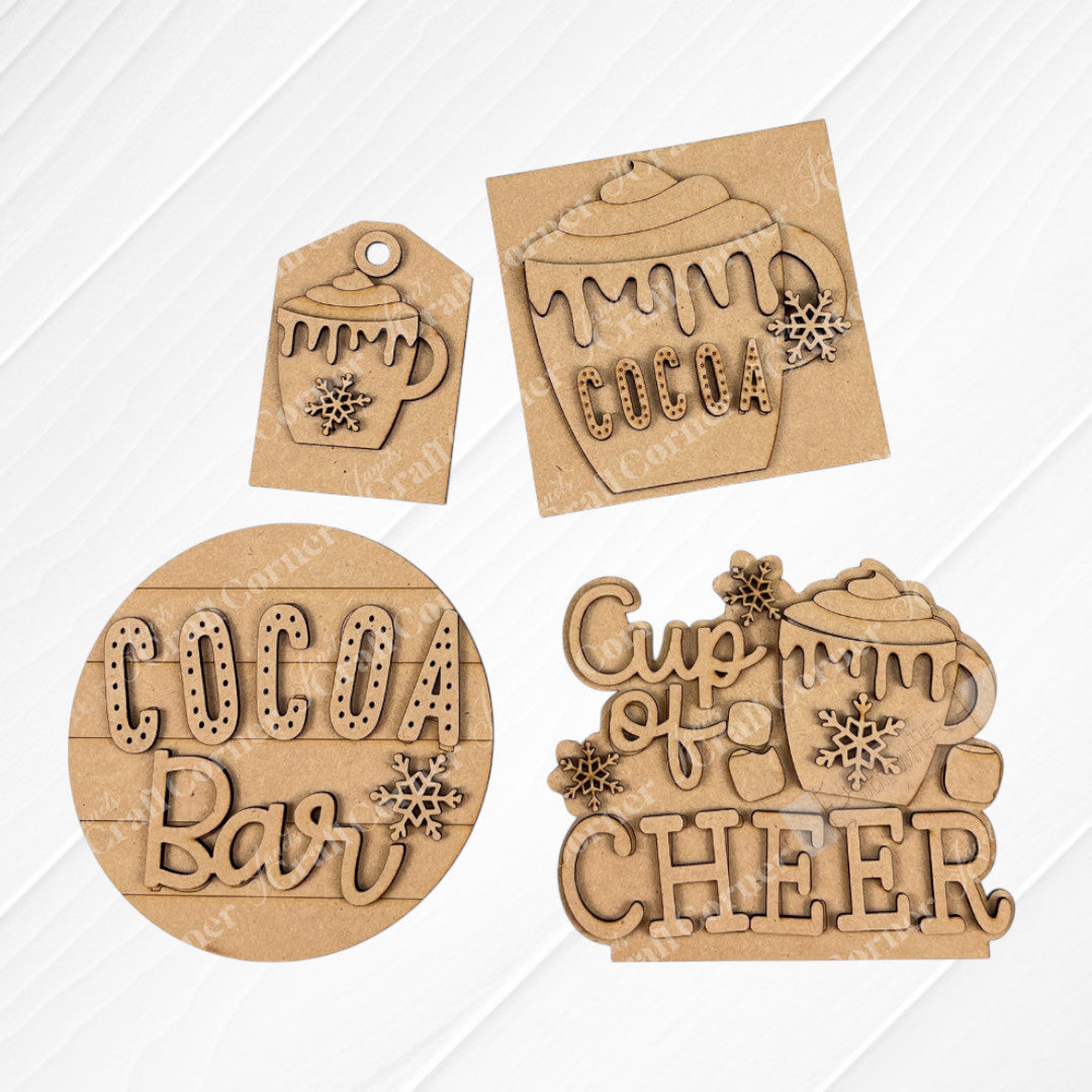 Janet's Craft Corner Cup of Cheer Hot Cocoa Mini Shelf Sitter is a DIY seasonal decor kit. This laser-cut wooden ornament features winter accents, perfect for cozy hot cocoa decor or as a festive craft project. Set of 1.