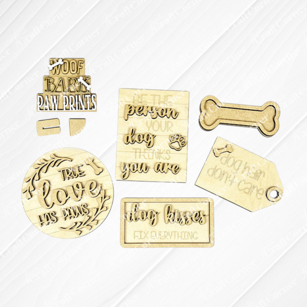 The Dog Lover Decor Set by Janet's Craft Corner is a DIY home decor craft kit featuring 6 wooden plaques and tags with dog-themed phrases like "Be the person your dog thinks you are" and "Dog hair don't care," plus paw print designs, perfect for celebrating that true love has paws.