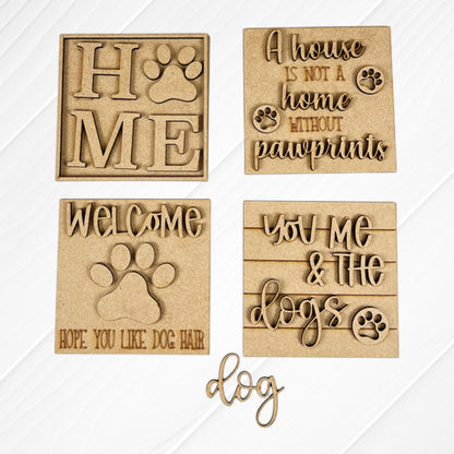 Janet's Craft Corner Dog Squares: Four wooden dog-themed signs—“HOME” with paw print, “A house is not a home without pawprints,” “WELCOME, hope you like dog hair,” and “You, me & the dogs.”—perfect for tiered trays.