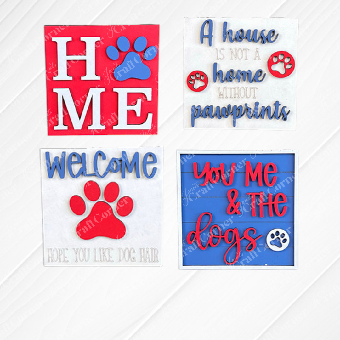 Dog Squares by Janet's Craft Corner: Four decorative wood cut-outs for tiered trays—"HOME" with a paw print, "A house is not a home without pawprints," "WELCOME Hope you like dog hair," and "You, me & the dogs." Swappable Squares style.