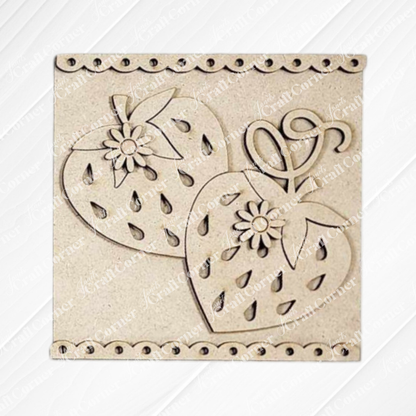 The Strawberry Swappable Squares DIY craft kit by Janet's Craft Corner features a light square panel with two stylized strawberries, leaves, flowers, and a dotted border—perfect as tiered tray decor for seasonal home accents.