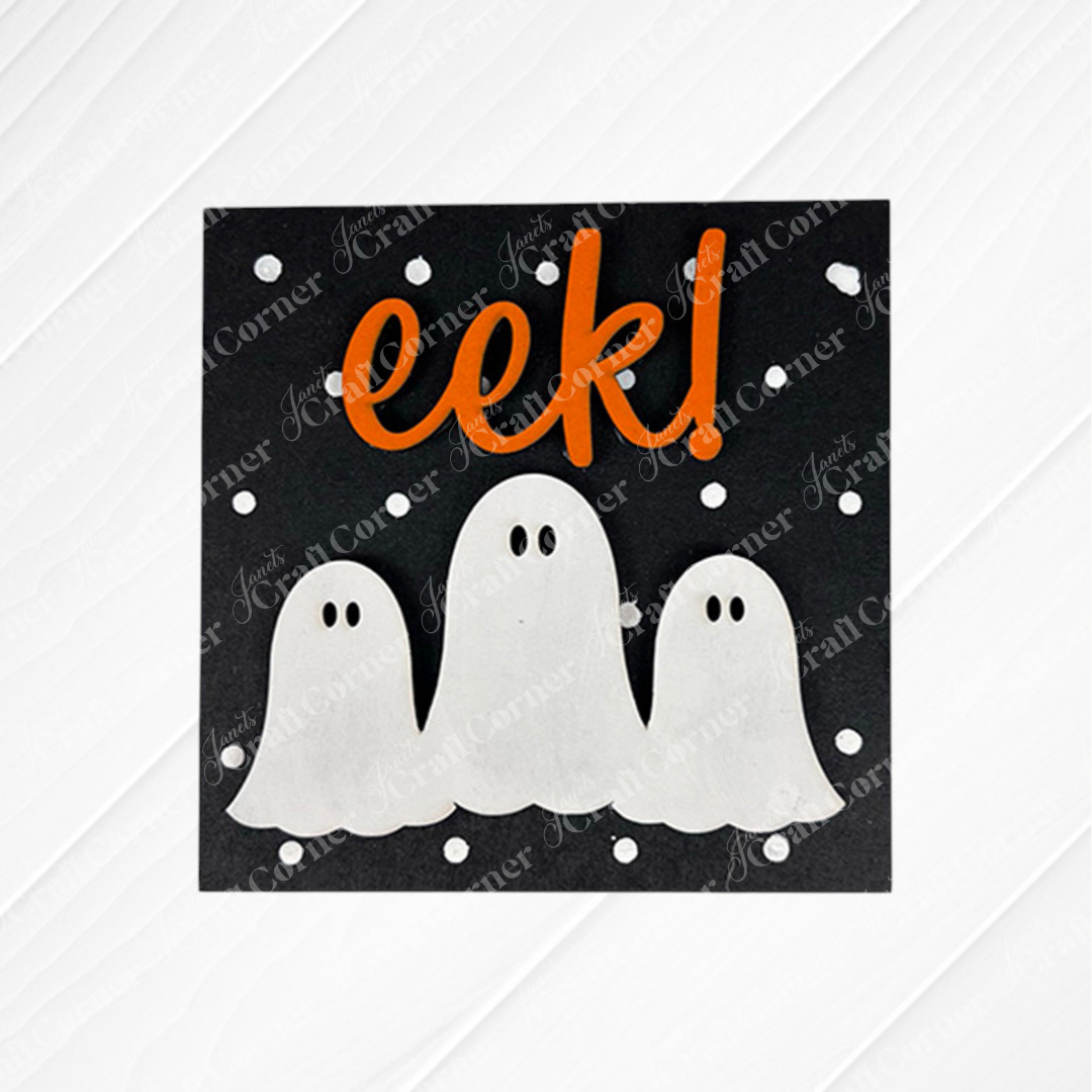 The Halloween Squares by Janet's Craft Corner is a black swappable sign featuring "eek!" in bold orange, three white cartoon ghosts, and polka dots on a textured white background—perfect for tiered tray decor.