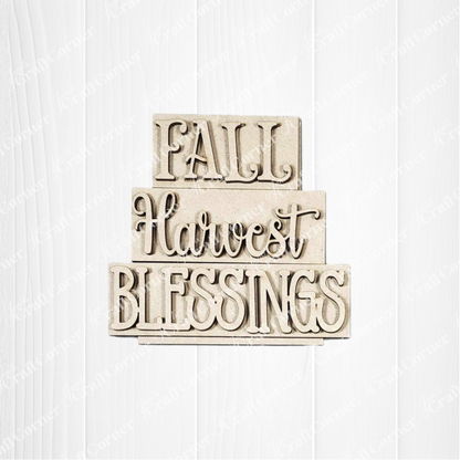 Janet’s Craft Corner Fall Harvest Mini Shelf Sitters is a DIY seasonal home decor kit featuring a textured wooden sign with "FALL," "Harvest," and "BLESSINGS"—perfect for autumn displays. Set of 1.