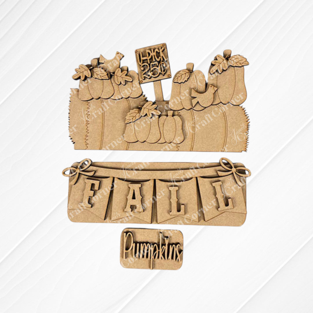 Janet's Craft Corner offers a DIY home decor kit that showcases wooden fall-themed decorations on a burlap background, featuring pumpkins with a "Pick of the Patch" sign. This Fall Hay Bale Interchangeable Insert presents an "FALL" banner and includes a small "Pumpkins" sign, ideal for capturing the essence of autumn elegance in your seasonal décor.
