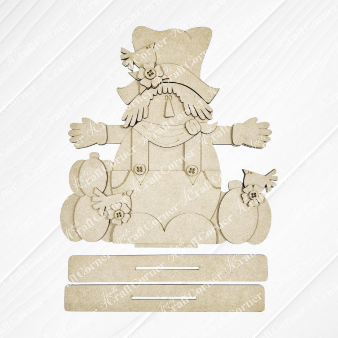 Janet's Craft Corner Fall Scarecrow Shelf Sitter is a DIY seasonal home decor craft kit (set of 1) featuring a rustic scarecrow with hat, scarf, and patch details—perfect autumn decor for your shelf.