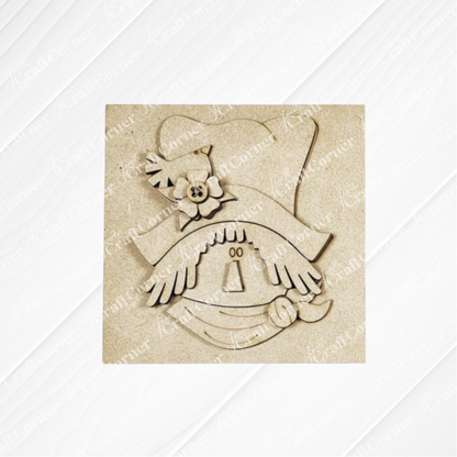 Janet's Craft Corner Fall Scarecrow Squares is a laser-cut wooden decoration with a smiling scarecrow, wide hat, flower, and handkerchief—perfect for seasonal home decor or DIY crafts.
