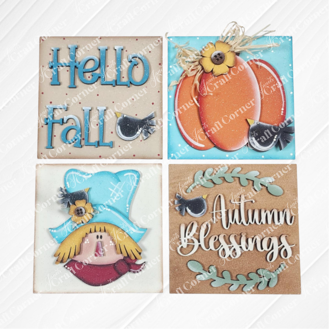 Janet's Craft Corner Fall Scarecrow Squares kit includes four decorative tiles: “Hello Fall,” two orange pumpkins, a scarecrow face with blue hat, and “Autumn Blessings” with leaves—ideal autumn home décor.