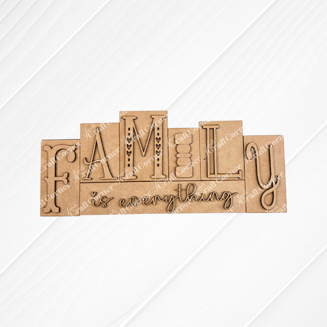 The Family is Everything Word Block by Janet's Craft Corner features "FAMILY is everything" in artistic lettering against a textured beige and white background with intricate patterns, making it ideal for home decor.