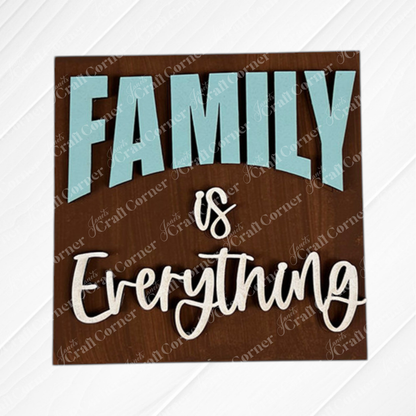 Family Home Squares by Janet's Craft Corner feature "Family is Everything" in bold blue and white lettering on brown wood—ideal for tiered tray decor or mixing with other wood cut-outs for a warm, inviting touch.