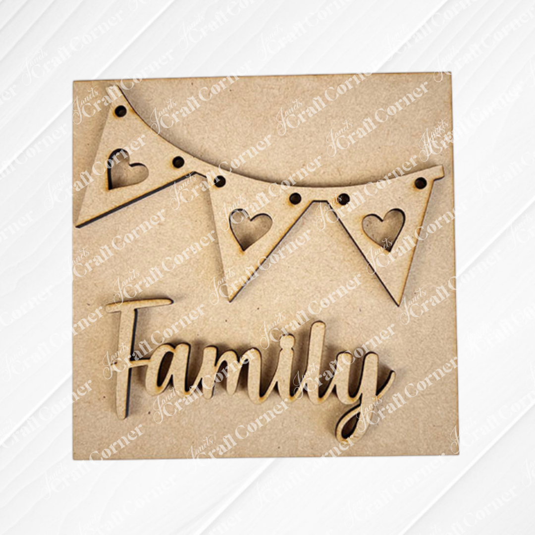 Janet's Craft Corner’s Family Home Squares features a wooden triangular bunting with heart shapes and “Family” in cursive below—perfect as tiered tray decor against a plain background.