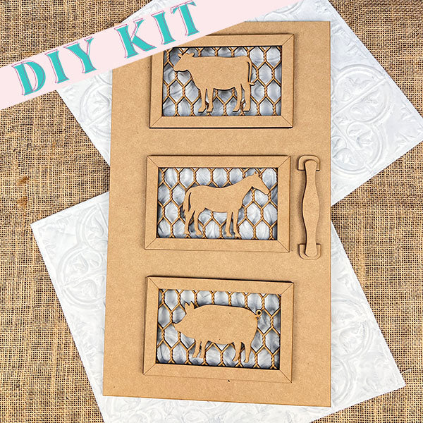 Introducing the Farm Animals Screen Door Sign by Janet's Craft Corner: a DIY kit that includes a wooden frame featuring silhouettes of a cow, horse, and sheep. Ideal for farmhouse decor, this piece comes with a rustic handle and mesh background, set against a textured burlap surface. The words "DIY KIT" are displayed in the corner.