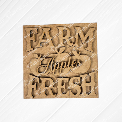 Janet's Craft Corner Farm Fresh Apples Square: Wooden sign with "FARM FRESH Apples" cutout letters and three apple shapes, ideal for DIY home decor in small spaces, displayed on a white textured surface.