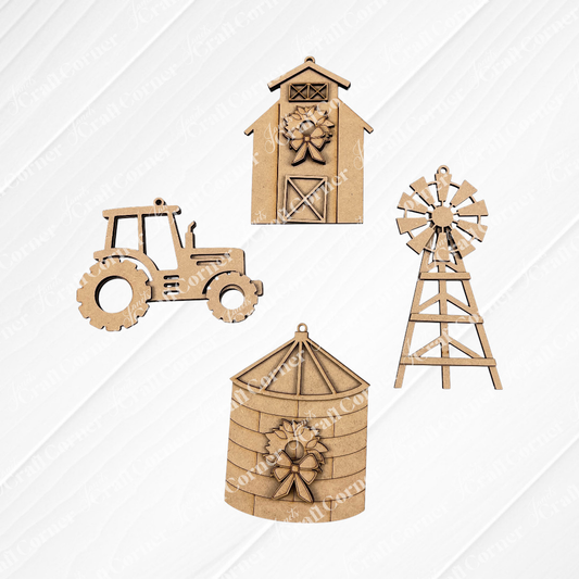 The Farm Life Christmas Ornaments - Set of 4 from Janet's Craft Corner, featuring a tractor, barn, silo, and windmill, capture the essence of farm life. Displayed on a textured white square with a burlap background, these ornaments can be utilized as part of a DIY Decoration Kit or as delightful Christmas decorations for your festive setting.