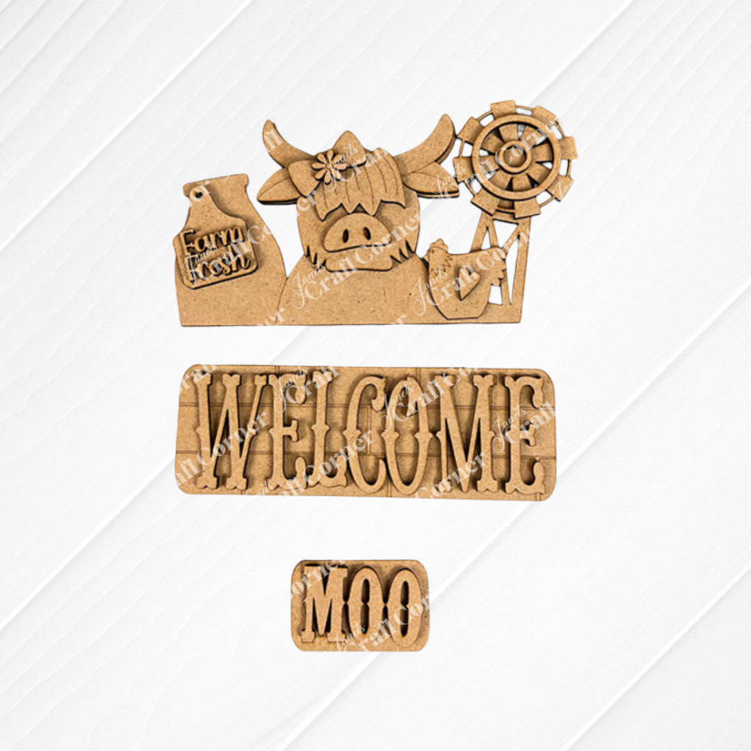 Janet's Craft Corner offers a delightful DIY home decor kit called the Farm Welcome Interchangeable Insert, perfect for adding farmhouse charm. This hand-painted set includes wooden cutouts featuring a cow with a windmill and a "Farm Fresh" tag, a "WELCOME" sign, and a small "MOO" sign. The burlap fabric background enhances the rustic appeal of this craft project.