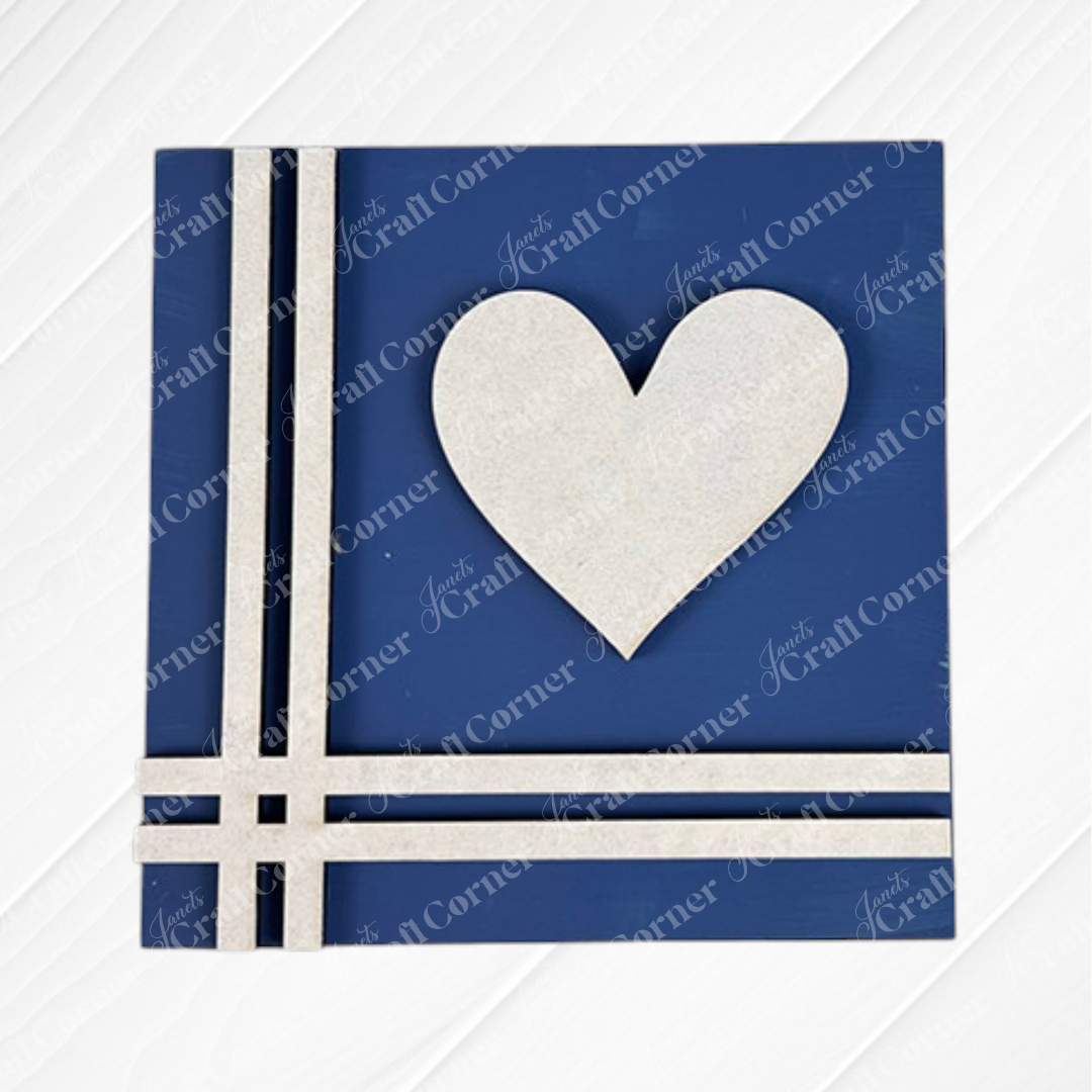 The Home Squares card by Janet's Craft Corner is a square blue piece with three white lines at the lower left, a large white heart on the right, and a subtle wood-like diagonal texture—ideal for tiered tray decor.