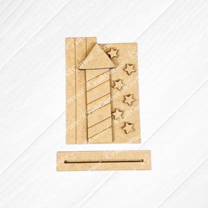 Janet's Craft Corner Patriotic Mini Shelf Sitters – DIY Craft Kit features a wooden firework rocket cutout with stripes, five stars, and a separate base—perfect for Americana décor on any shelf.