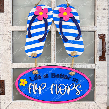 Add a coastal touch with Janet's Craft Corner Flip Flops Door Hanger DIY Kit (13.5" x 11"), featuring blue-and-white striped flip-flops, pink flowers, and an oval plaque that reads "Life is Better in Flip Flops." Ideal for beach-themed decor!.