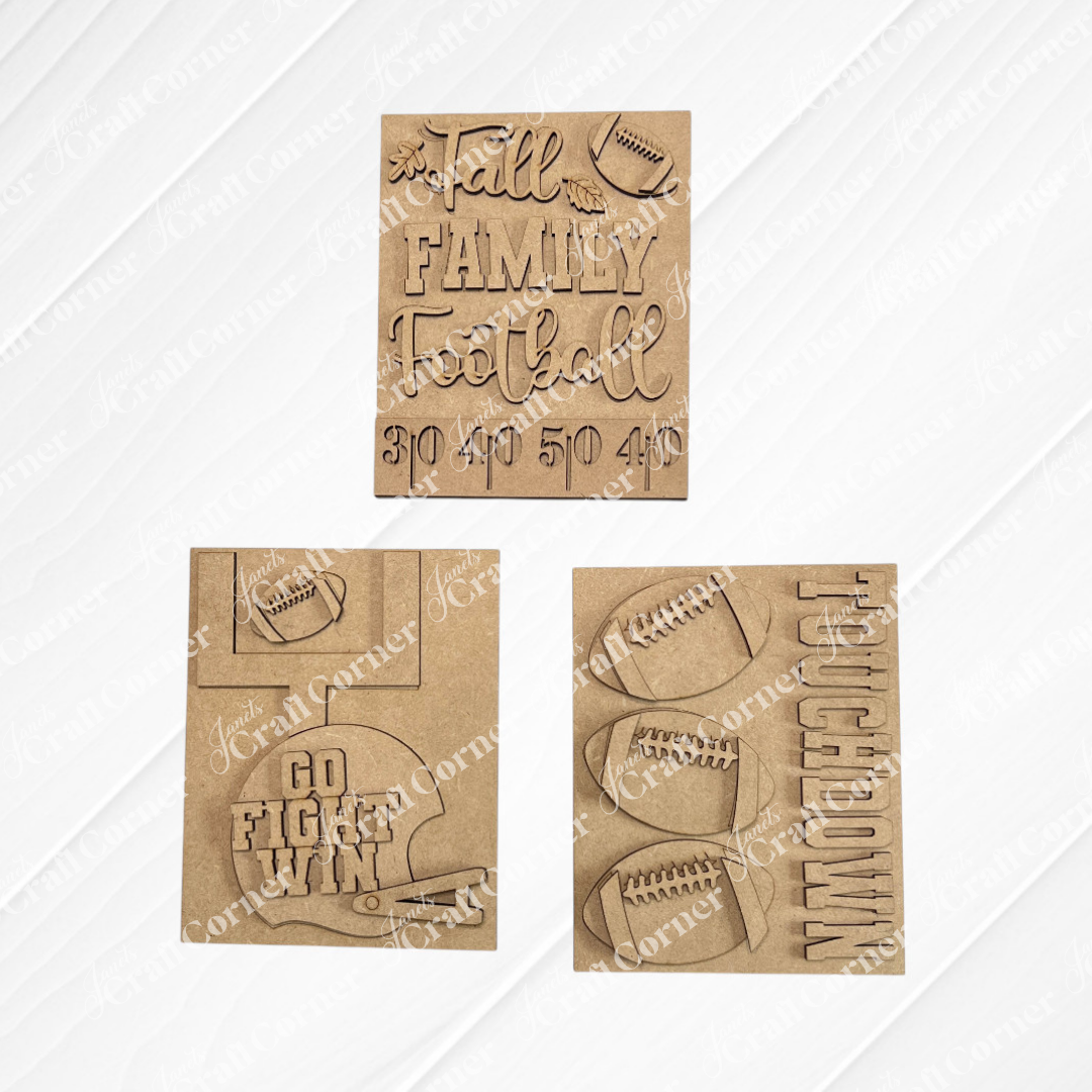Three brown cardboard cutouts from Janet’s Craft Corner’s Football Farmhouse Signs feature football-themed designs, such as footballs, phrases like “Fall Family Football,” “Touchdown,” and “Go Fight Win,” along with numbers and a football helmet—making them ideal for an interchangeable seasonal decor display or as part of a DIY home decor kit.