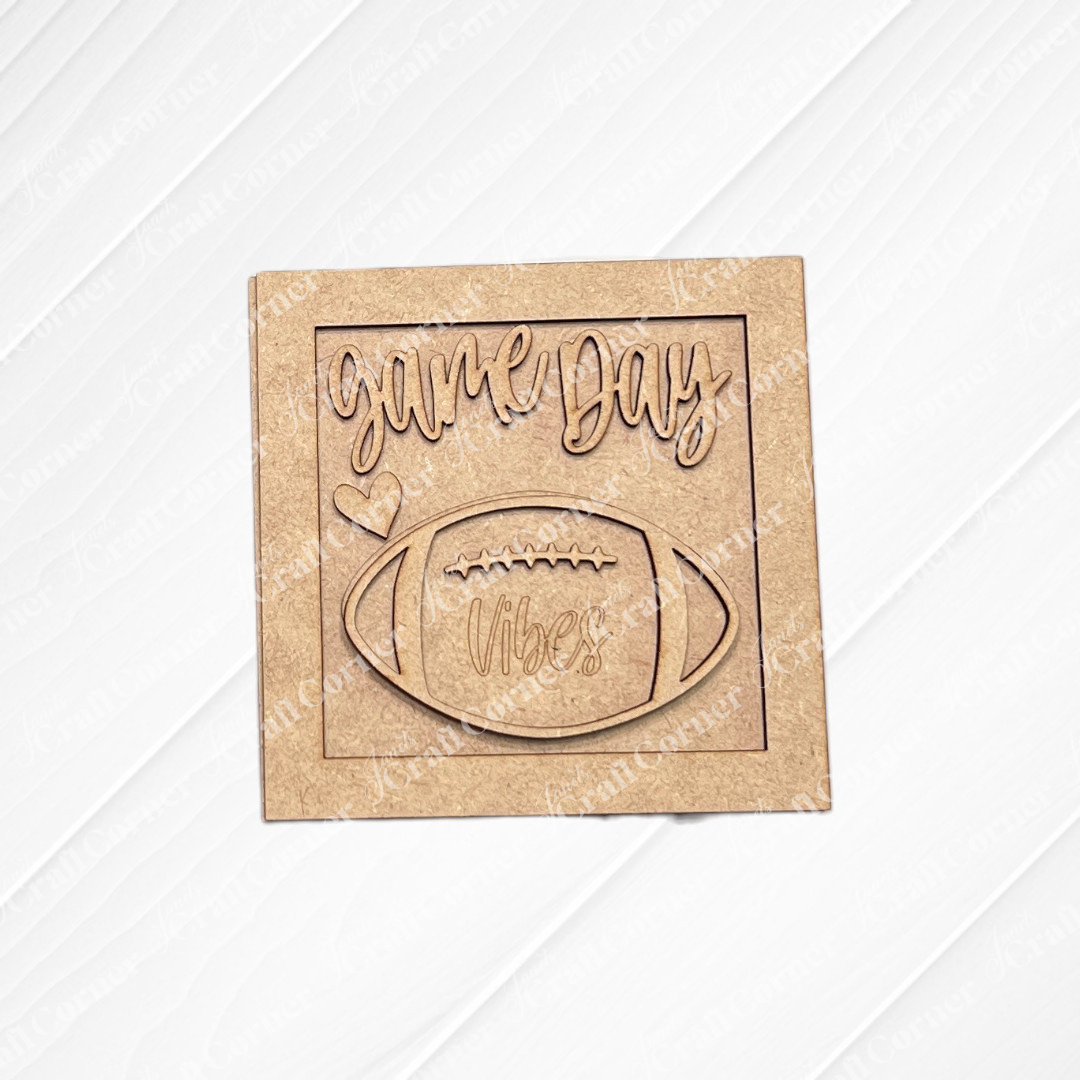 Janet's Craft Corner Football Decor Set is a DIY craft kit featuring layered wood "game day vibes" text, football, and heart designs—perfect tiered tray or mini shelf sitters. Choose from 5 styles for unique game day decor.