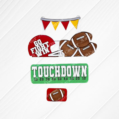 Transform your space with Janet's Craft Corner's Football Interchangeable Insert DIY home decor kit. This hand-painted set features wooden cutouts, including a football helmet inscribed with "Go Fight Win," four footballs, and a “Touchdown” sign above a set of yard markers. It also comes with an additional smaller football insert at the bottom – perfect for adding a personalized touch to your decor.
