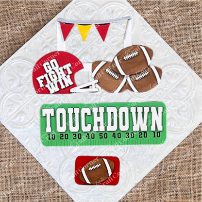 Transform your space with Janet's Craft Corner's Football Interchangeable Insert DIY home decor kit. This hand-painted set features wooden cutouts, including a football helmet inscribed with "Go Fight Win," four footballs, and a “Touchdown” sign above a set of yard markers. It also comes with an additional smaller football insert at the bottom – perfect for adding a personalized touch to your decor.