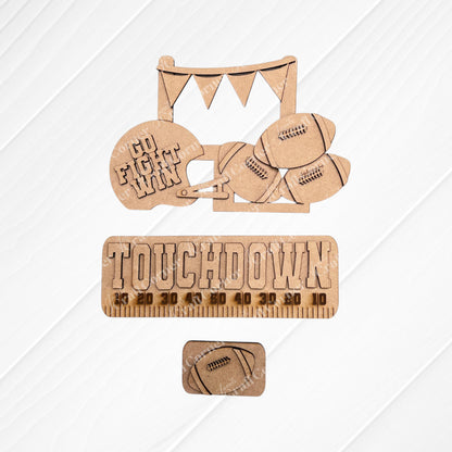 Transform your space with Janet's Craft Corner's Football Interchangeable Insert DIY home decor kit. This hand-painted set features wooden cutouts, including a football helmet inscribed with "Go Fight Win," four footballs, and a “Touchdown” sign above a yard line. It also comes with an additional smaller football insert at the bottom – perfect for adding a personalized touch to your decor.