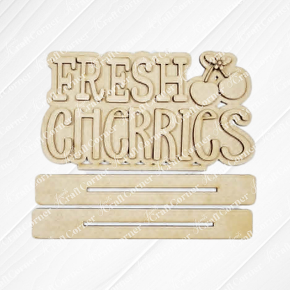 The Cherry Decor Set by Janet's Craft Corner features a wooden "FRESH CHERRIES" sign with a cherry illustration and two blank spaces for customization—ideal as a farmhouse accent or DIY craft for your home decor kit.