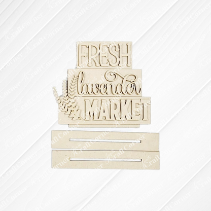 Janet's Craft Corner’s Lavender Decor Set features cream-colored layered signs reading "FRESH lavender MARKET" with lavender sprigs, ideal for DIY or lavender-themed home decor. Includes two slotted rectangular pieces below the signs.