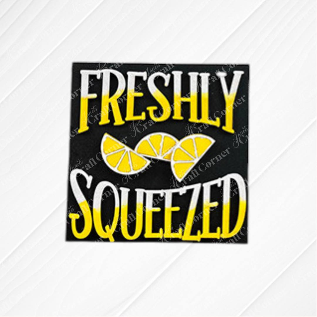Janet's Craft Corner Lemon Squares sign features "Freshly Squeezed" in yellow and white, with three lemon slices on a black background—ideal for DIY seasonal home decor or your Swappable Squares craft kit.