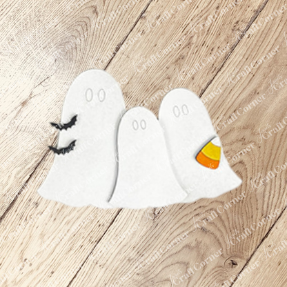 Janet's Craft Corner Halloween Mini Shelf Sitters DIY kit includes three cartoon ghosts—one with a bat, one with candy corn, and one plain—ideal for spooky DIY seasonal home decor. All have oval eyes and no mouths. Set of 1.