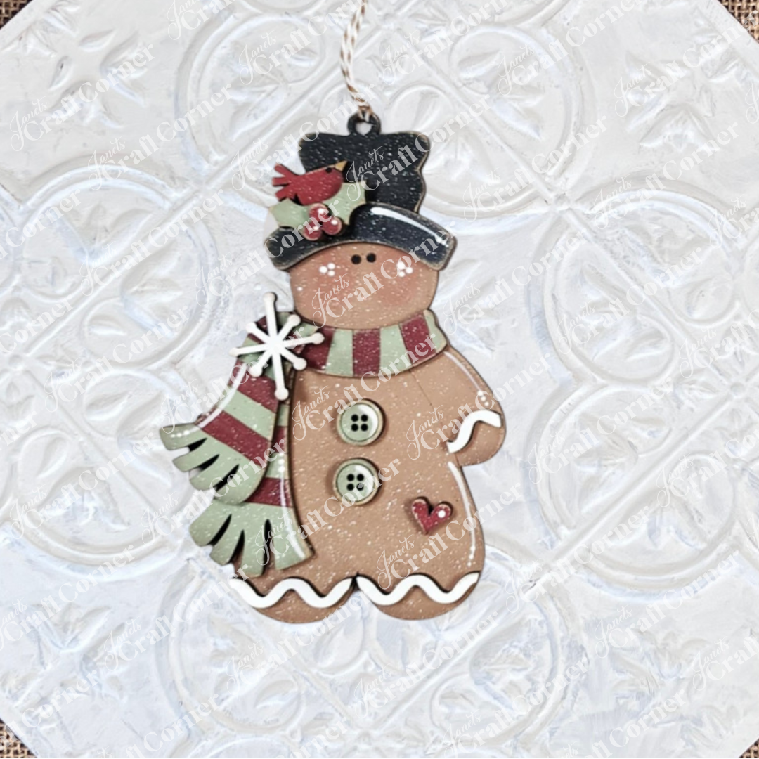 Janet's Craft Corner Gingerbread Ornaments DIY holiday craft kit (Set of 8) features snowman-shaped cookies with scarves, buttons, and black hats—ideal for charming holiday décor or festive crafting fun.