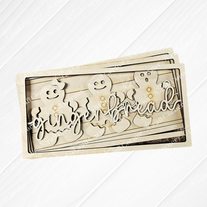 The delightful Gingerbread Chunky Shelf Sitter DIY Home Decor Kit by Janet's Craft Corner features a wooden piece with three gingerbread figures, smooth edges, and the word "gingerbread" elegantly displayed. Its rustic, light wood finish makes it a charming addition to any home décor.