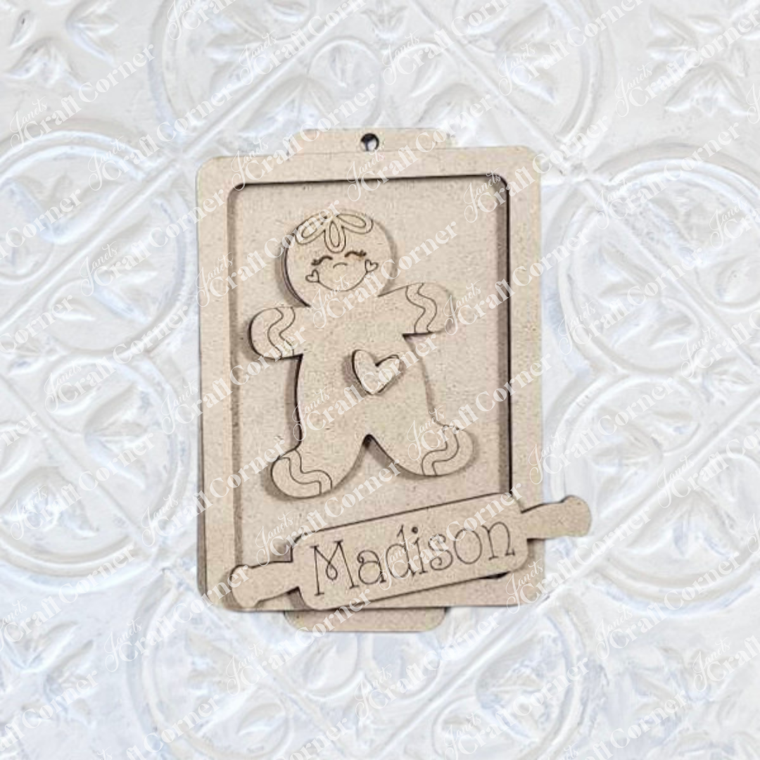 Janet's Craft Corner Gingerbread Ornaments - DIY holiday craft kit (Set of 8) features wooden gingerbread figures with heart details and customizable nameplates, perfect for festive décor.