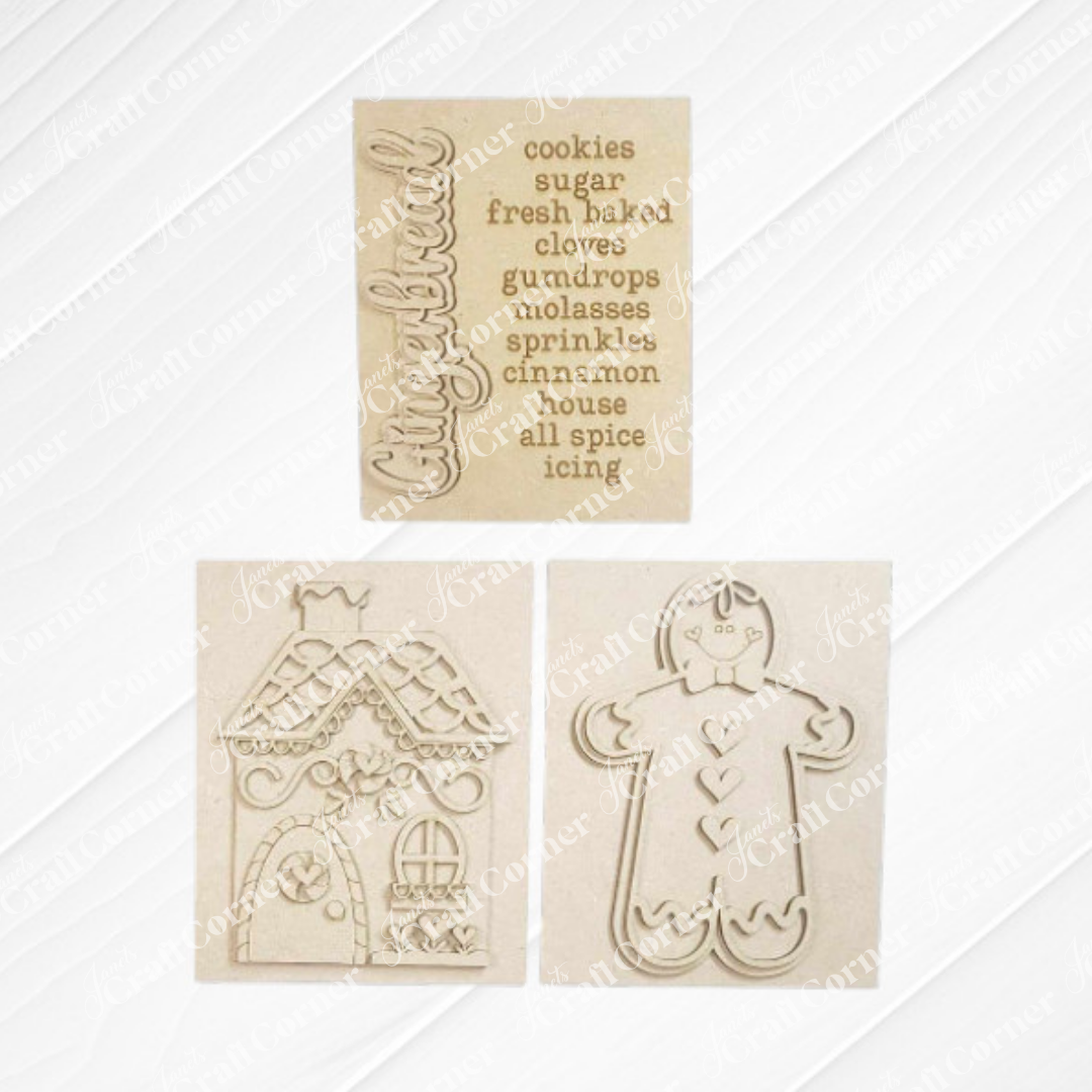 Janet's Craft Corner – Sample painted set of Gingerbread Switchable Farmhouse Sign is a DIY seasonal home decor kits with a gingerbread theme. One features the word Gingerbread with words that evoke gingerbread cookies during the holidays, another features a gingerbread man and one that features a cute gingerbread house, all displayed on a white wooden background. 