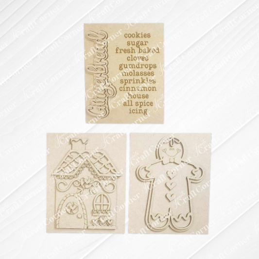 Janet's Craft Corner – Sample painted set of Gingerbread Switchable Farmhouse Sign is a DIY seasonal home decor kits with a gingerbread theme. One features the word Gingerbread with words that evoke gingerbread cookies during the holidays, another features a gingerbread man and one that features a cute gingerbread house, all displayed on a white wooden background. 